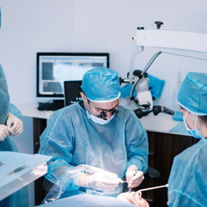 Dentists conducting a dental implant surgery