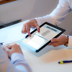 An insurance agent discussing dental insurance with a patient